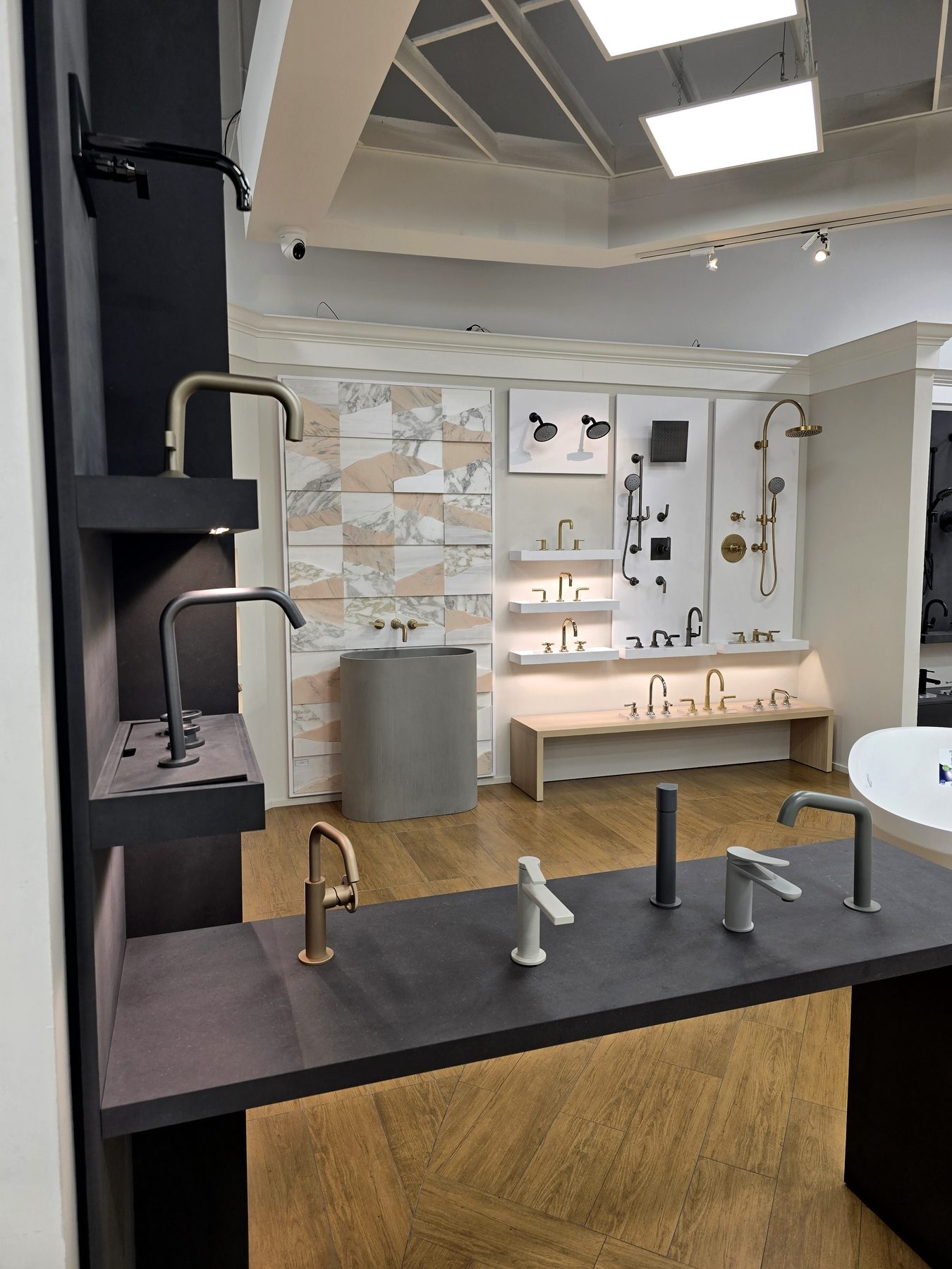 Marble and terrazzo wall with brass fixtures