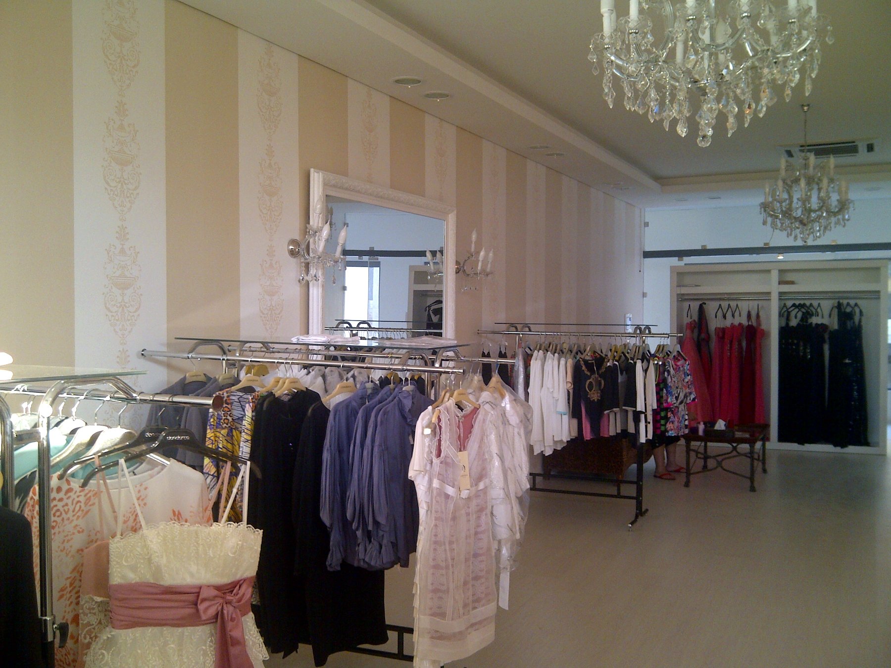 Fashion boutique with crystal chandeliers and striped walls